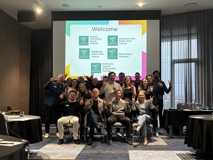 The Clublinks Darebin team at a recent planning day, all posing with peace signs